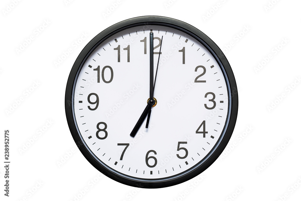 Wall clock shows time 7 o'clock on white isolated background. Round wall clock - front view. Nineteen o'clock Wall clock shows time 7 o'clock on white isolated background. Round wall clock - front view. Nineteen o'clock
