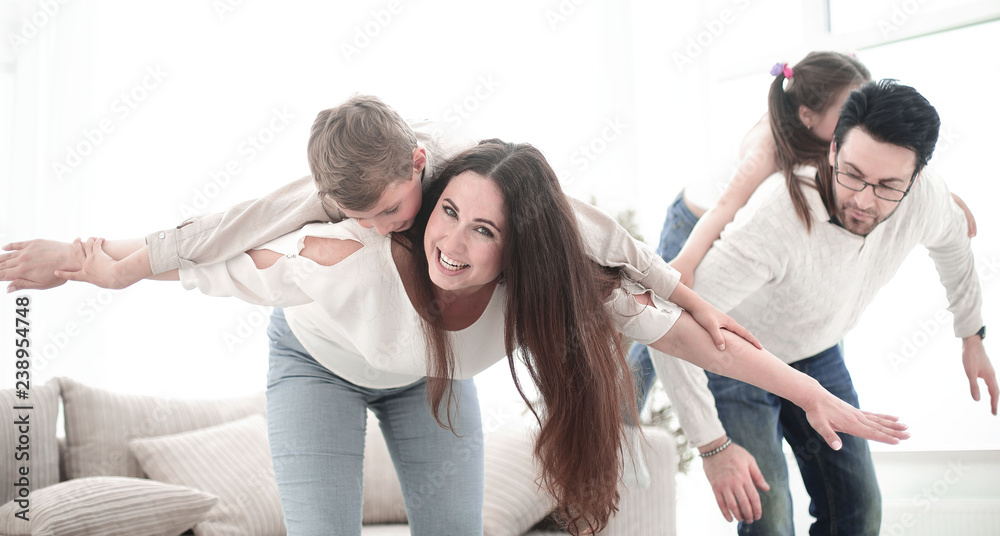 Obraz premium happy parents with their children have fun