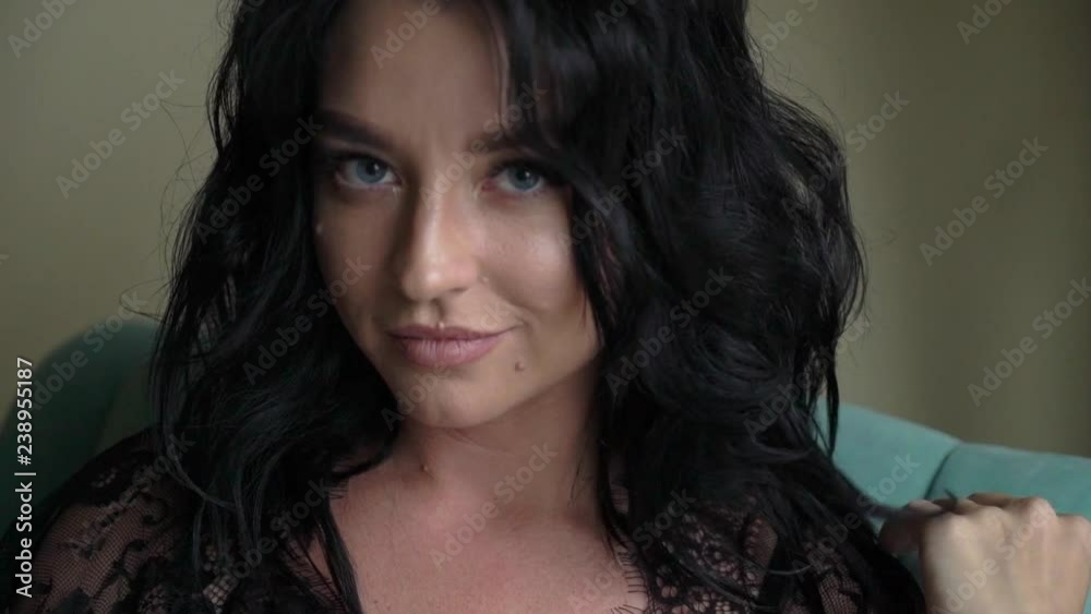 Young sexy brunette woman in lingerie sitting on chair in bedroom and posing. Flirting of lovely female in hotel room. Slowmotion Young sexy brunette woman in lingerie sitting on chair in bedroom and posing. Flirting of lovely female in hotel room. Slowmotion