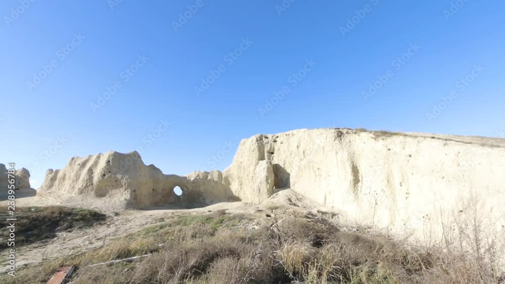 Man going to Portal hole in a cave rock formation Man going to Portal hole in a cave rock formation