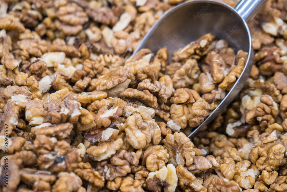 Full frame of peeled raw organic walnuts in the market. Walnut background texture Full frame of peeled raw organic walnuts in the market. Walnut background texture