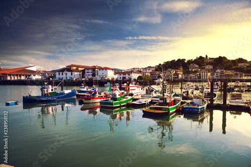 Fishing boats in Saint Jean de Luz harbour in Pays Basque, France photo