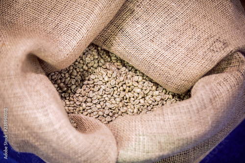 Big sack of coffee beans waiting to be roasted in roaster warehouse