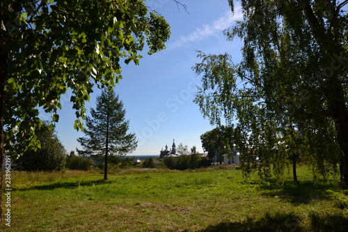 Чердынь: вид сквозь деревья на церковь Ильи Пророка и Троицкое городище  photo