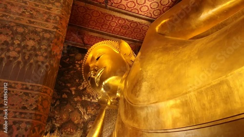 Reclining buddha at Wat Pho or Wat Phra Chetuphon Vimolmangklararm Rajwaramahaviharn which is one of Bangkok's oldest temples in Bangkok. photo