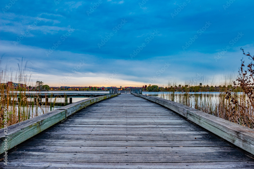 Wooden pier on the lake at sunset