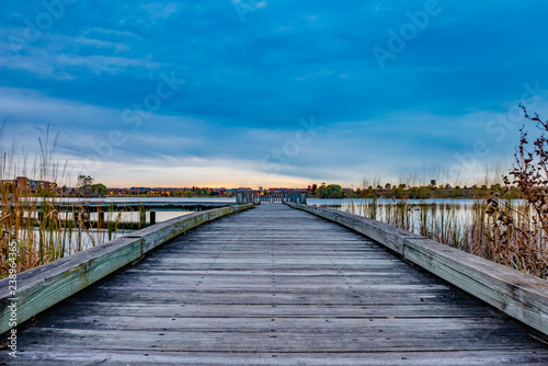 Wooden pier on the lake at sunset © Arthur