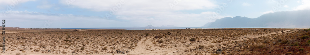 Island desert with dirt road