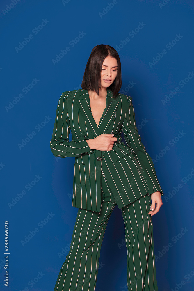Attractive lady in fashionable suit.