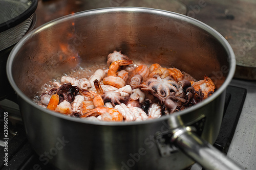 Stir fried mixed seafood. flaming. Selectiva focus