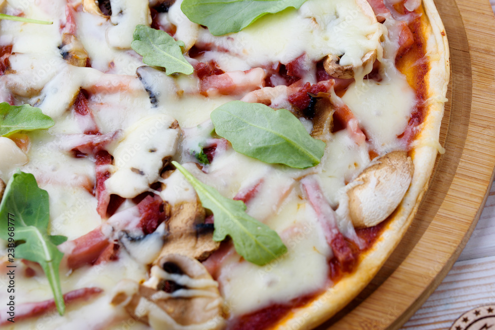 Tasty and flavorful pizza on the table. Appetizing homemade pizza. Tasty and flavorful pizza on the table. Appetizing homemade pizza.
