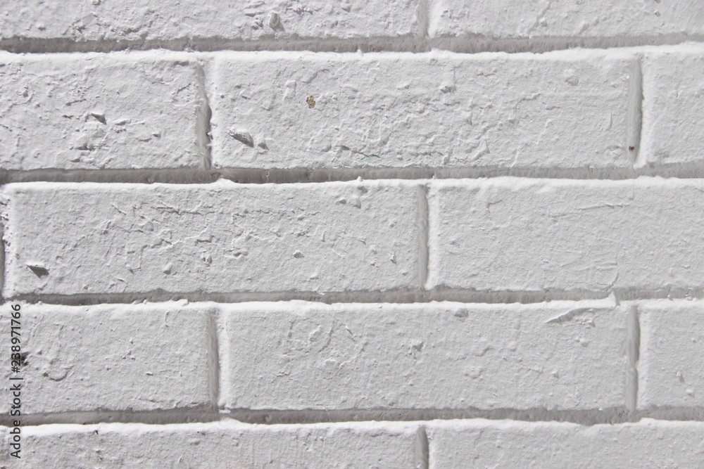 Fototapeta premium Vintage Brick Wall With White plaster Square texture or background. Whitewashed wall Painted Bricks. Old White Stone Wall. Background Texture