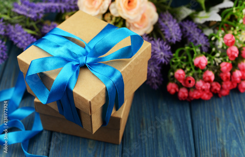 surprise gift box with blue summer with a bouquet of roses photo