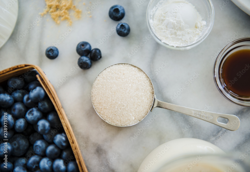 Blueberries, sugar, baking powder, lemon peel and maple syrup Blueberries, sugar, baking powder, lemon peel and maple syrup