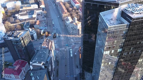 Aerial view of busy industrial city, glass buildings, banks, roads and cars