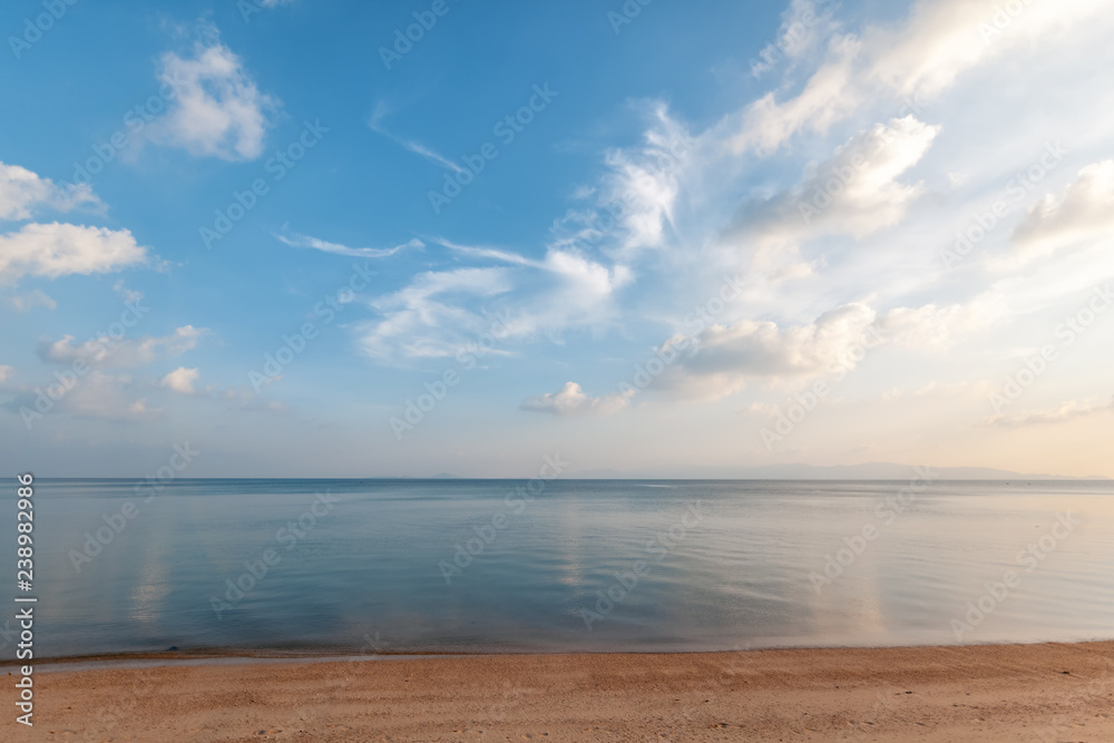 Bright beautiful seascape, sandy beach, clouds reflected in the water, natural minimalistic background and texture - obrazy, fototapety, plakaty 