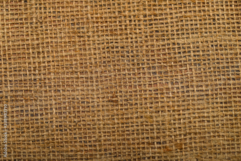 Background of the texture of natural weaving hemp rope sacking. Cropped shot, close-up, horizontal, abstract, top view Background of the texture of natural weaving hemp rope sacking. Cropped shot, close-up, horizontal, abstract, top view