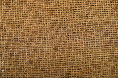 Background of the texture of natural weaving hemp rope sacking. Cropped shot  close-up  horizontal  abstract  top view