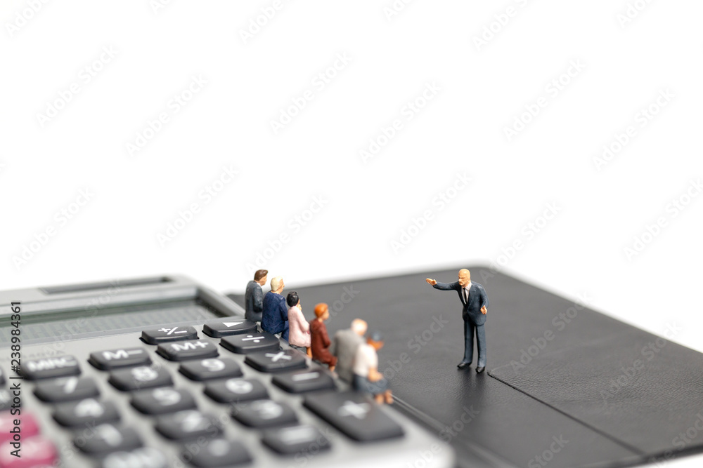 Miniature people : Business man meeting on calculator isolated on white background , Business and finance concept Miniature people : Business man meeting on calculator isolated on white background , Business and finance concept