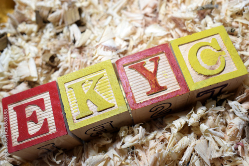 electronic-know your customer acronym on wooden blocks business and financial terminologies photo