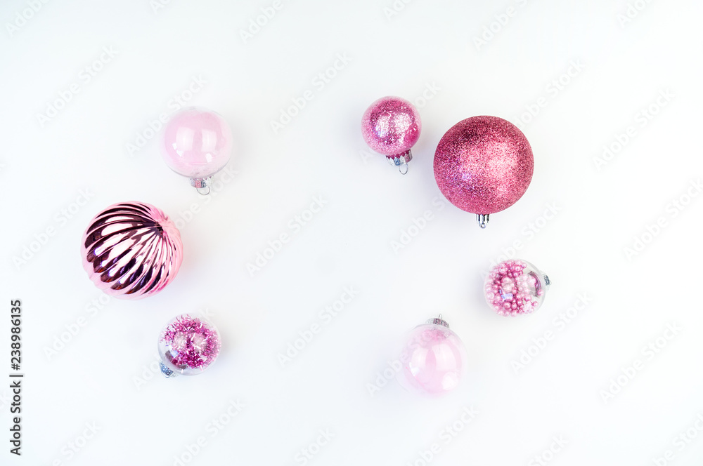 Gentle pink baubles on a white background. Christmas mood. Copy space Gentle pink baubles on a white background. Christmas mood. Copy space