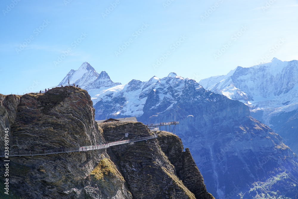 Beautiful outdoor scene of the mountain with blue sky at First Grindelwald,Swizerland.Scenic Panorama picture or postcard view landscape of Swiss Alps.Travel Vacation Holiday concept.