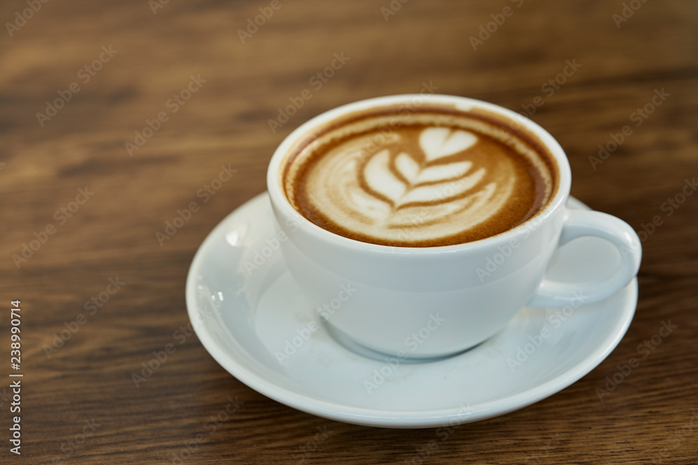 Cup of coffee with heart pattern