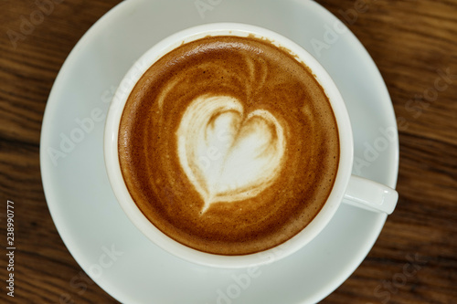 Cup of coffee with heart pattern
