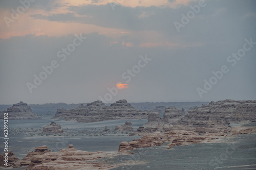Yardang rocks in gobi desert under sunset in Dunhuang Yardang National Geopark, Gansu, China photo