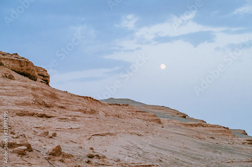Yardang rocks under moon in Dunhuang Yardang National Geopark, Gansu, northwest China photo