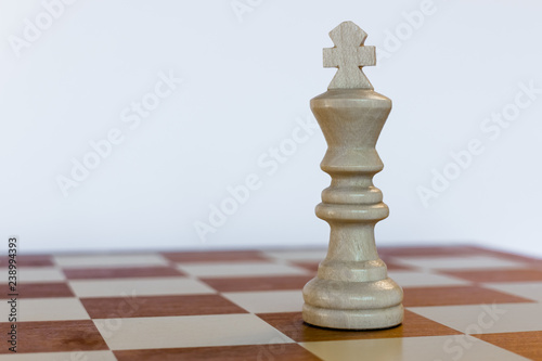White king on black square on chessboard