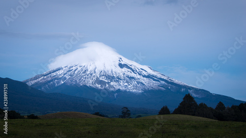 Clouds cover the snowcapped peak of Mount Taranaki