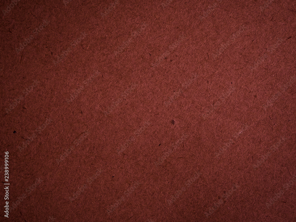 Fototapeta premium Texture of dark red cardboard closeup, abstract paper background