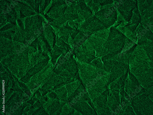 Texture of dark green crumpled craft paper. Texture for design, abstract background © ss404045