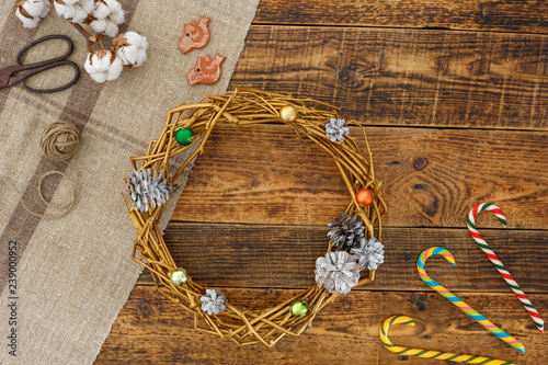 The decorative wreath decorated under gold. Handmade decoration for the New Year holidays.