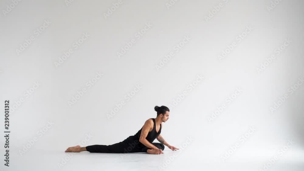 Man practicing intense yoga asana Man practicing intense yoga asana