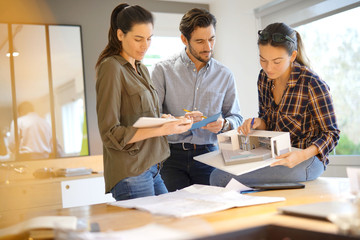 Architects looking over project for modern house design