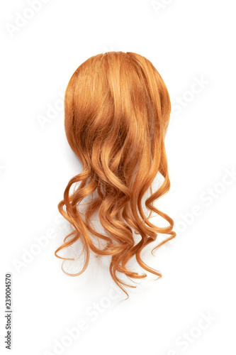 Natural wavy red hair on white background. Woman's head back view