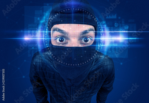Facial recognition system. Young man on blue background