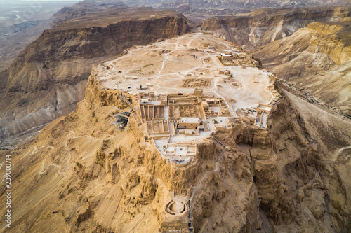 Masada fortress area Southern District of Israel Dead Sea area Southern District of Israel. Ancient Jewish fortress of the Roman Empire on top of a rock in the Judean desert, front view from the air photo
