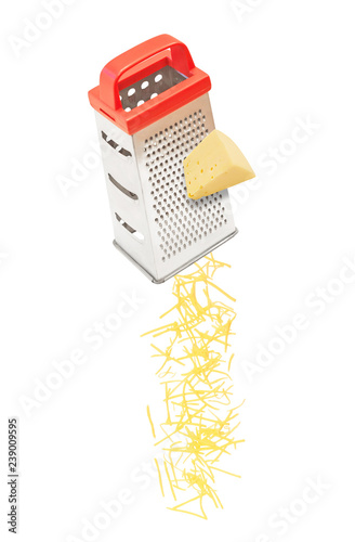 Grated cheese falling from metal grater isolated on white background photo