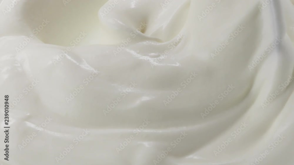 Slow motion of mixing yogurt with spoon Slow motion of mixing yogurt with spoon