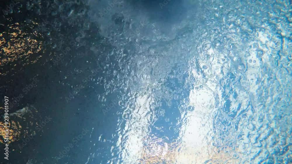 underwater view swimmer in pool passing from top underwater view swimmer in pool passing from top