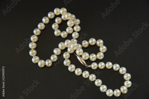 A pearl necklace for woman isolated on black background
