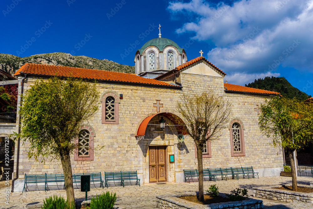 Naklejka premium Church of Saint George in Stemnitsa village, a popular winter destination in mountainous Arcadia in Peloponnese, Greece