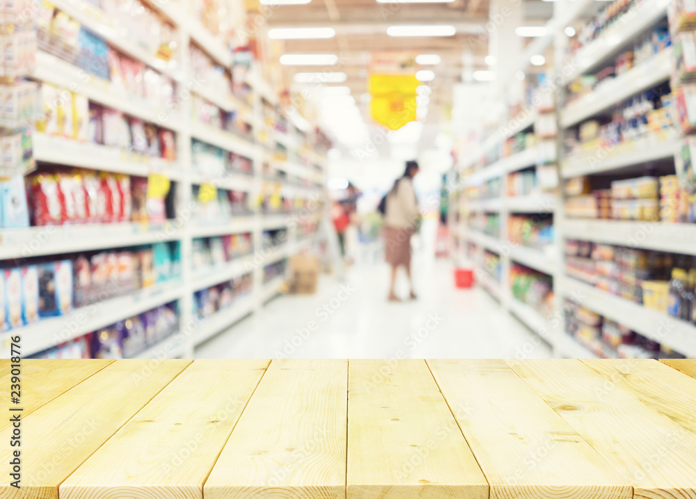 Supermarket or retail store blur background. That is a self-service shop offer grocery and variety of food, beverage and household product on shelf or rack. For shopping background or product display.