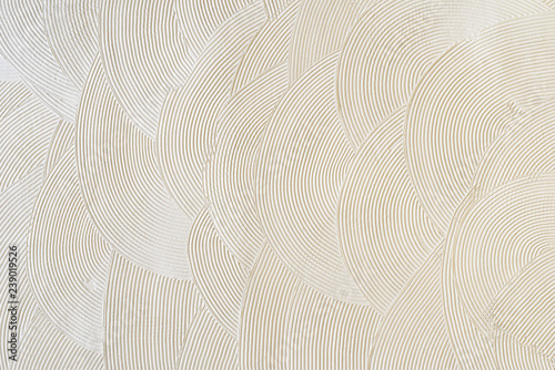Circular patterns on white plaster. Abstract texture