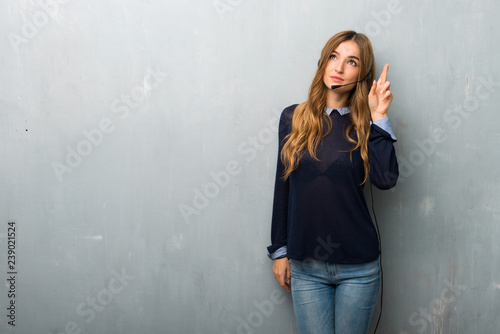 Telemarketer woman with fingers crossing and wishing the best