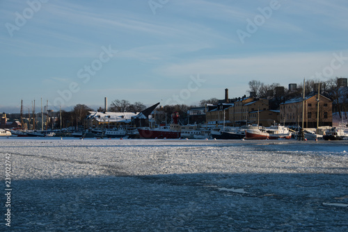 Sunset view over boats and islands in Stockholm a winter day  © Hans Baath