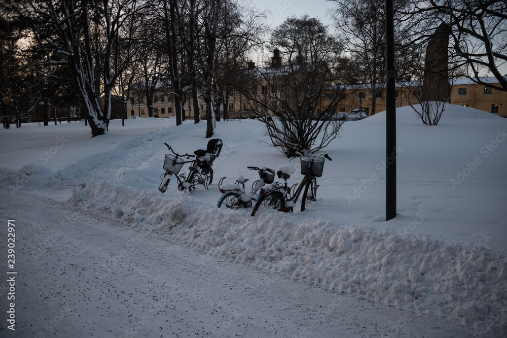 Bicycles in snow at winter in Stockholm Bicycles in snow at winter in Stockholm